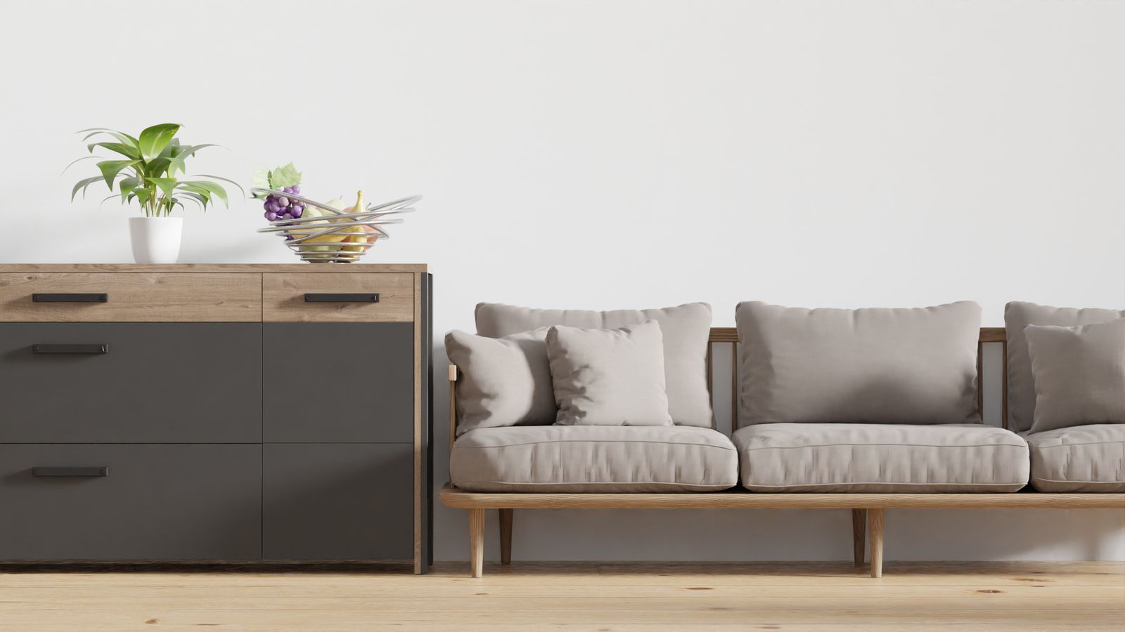 Salon minimaliste, canapé clair et coffre en bois.